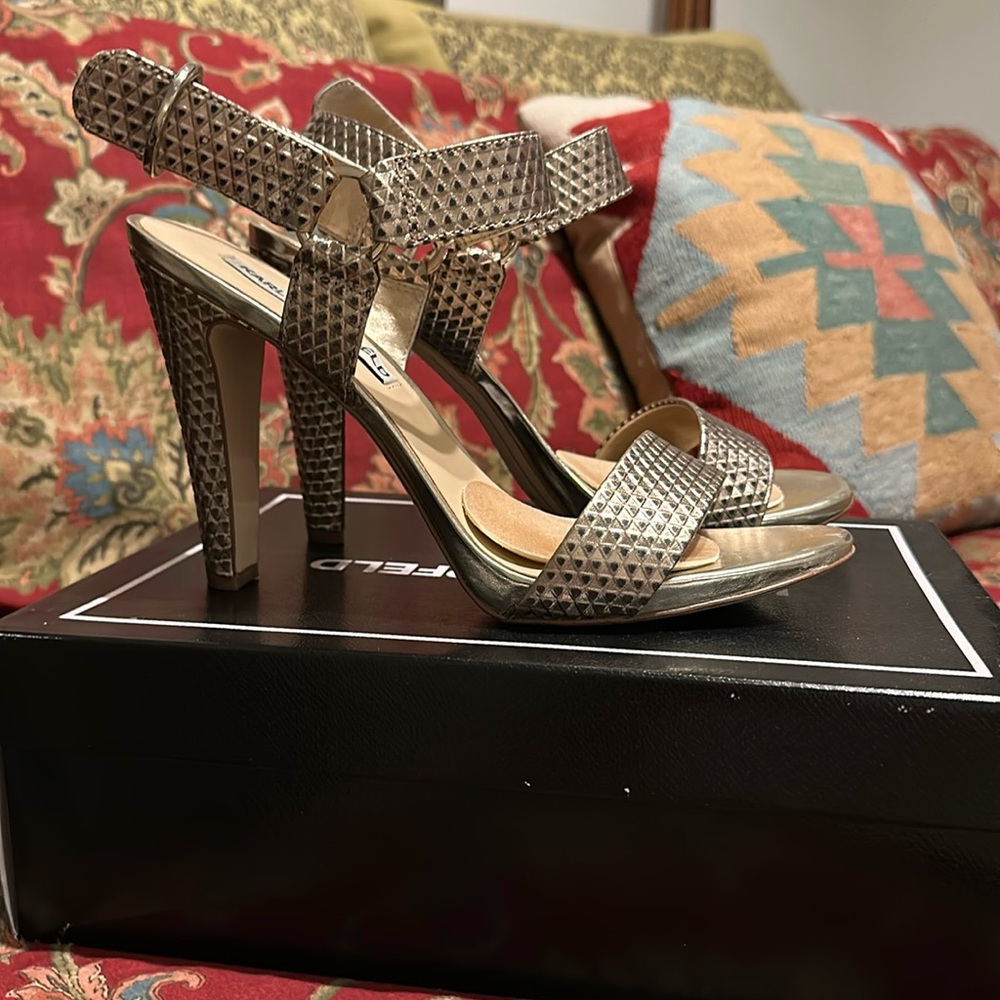 Karl Lagerfeld gold heels.